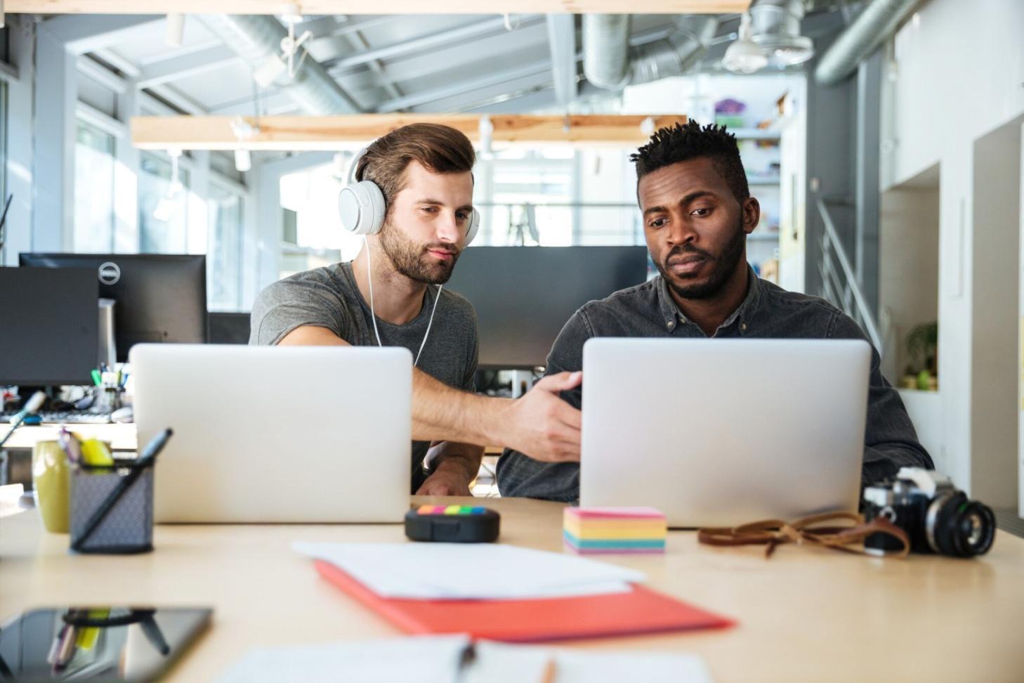 Finance professionals analyzing budget reports and workflow systems